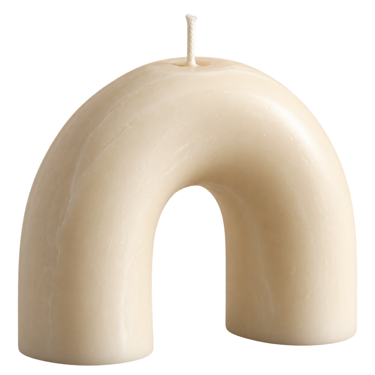 Concept sculptural candle made of warm ivory wax in an arch shape